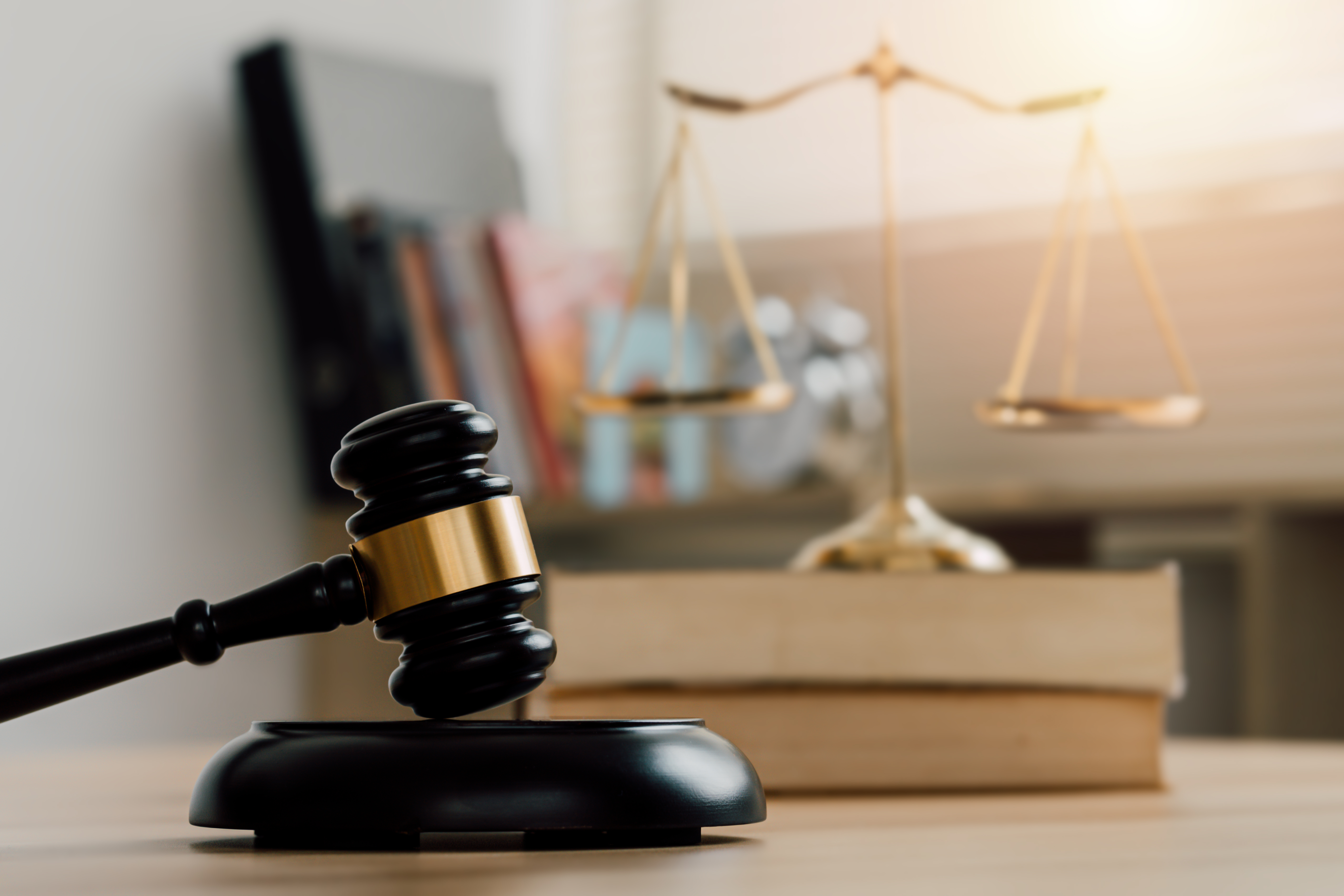 Law and justice concept. Mallet of the judge, scales and stack b
