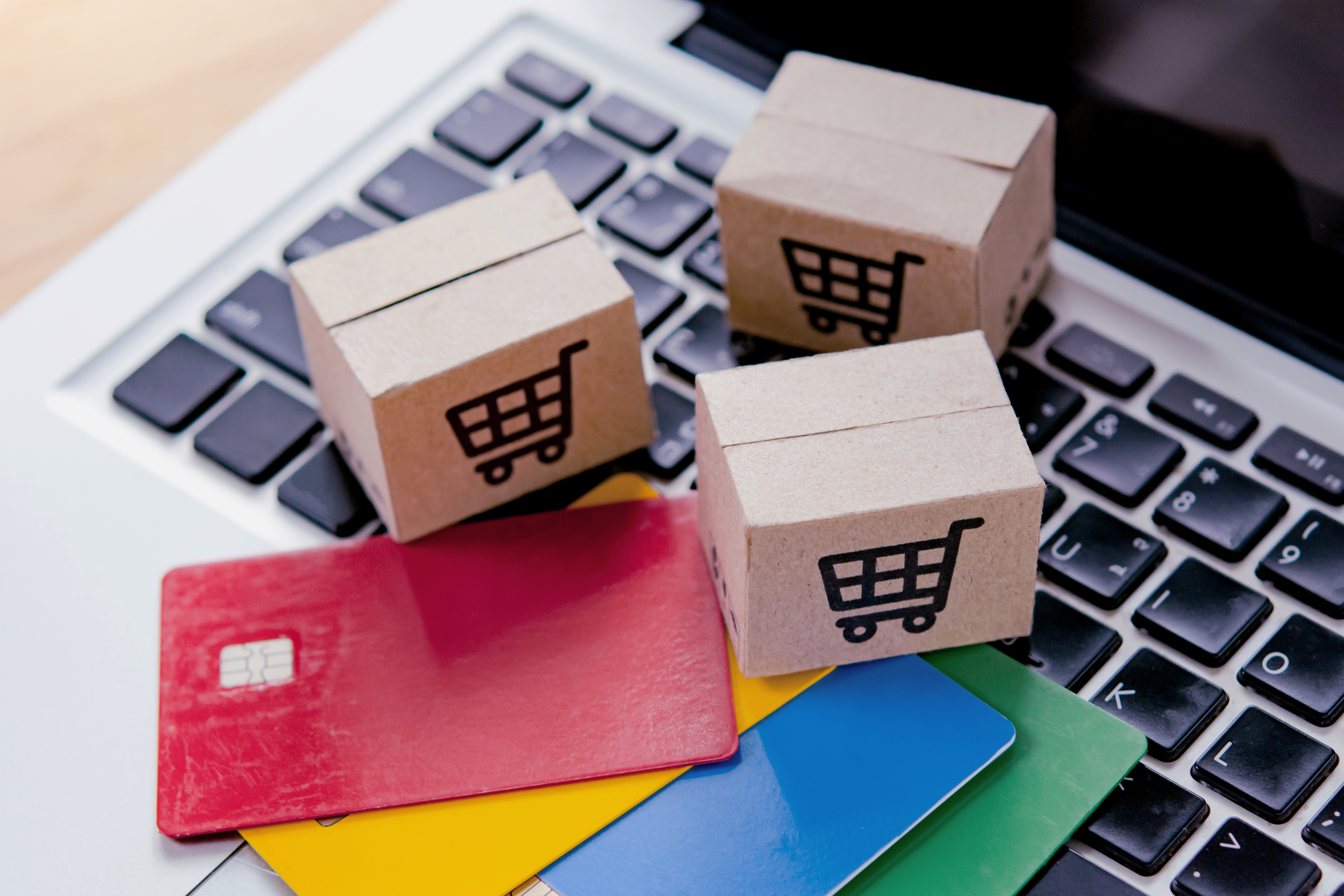 Shopping online. Credit card and cardboard box with a shopping c