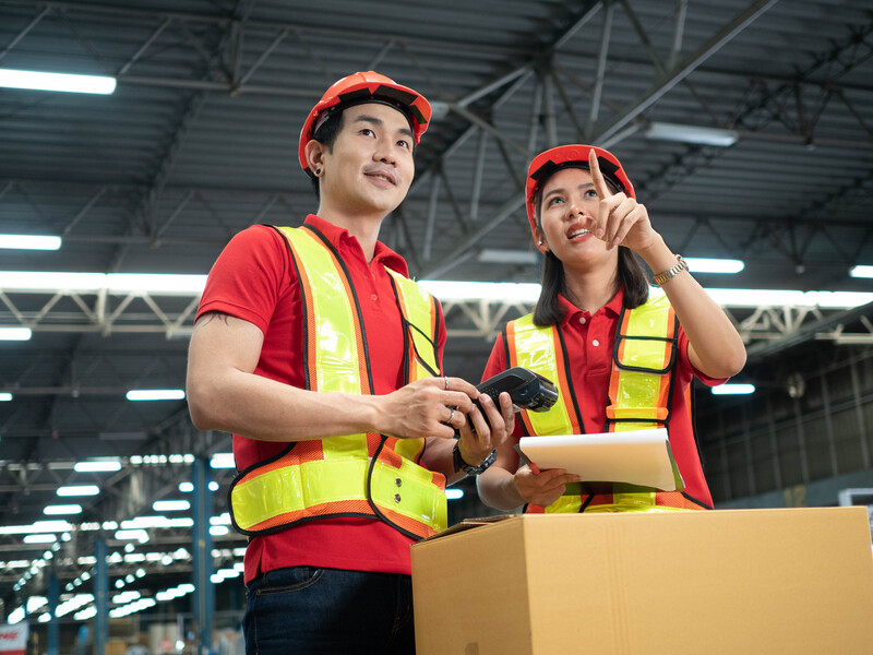 Male female woman man orange hardhat head wear helmet safety che